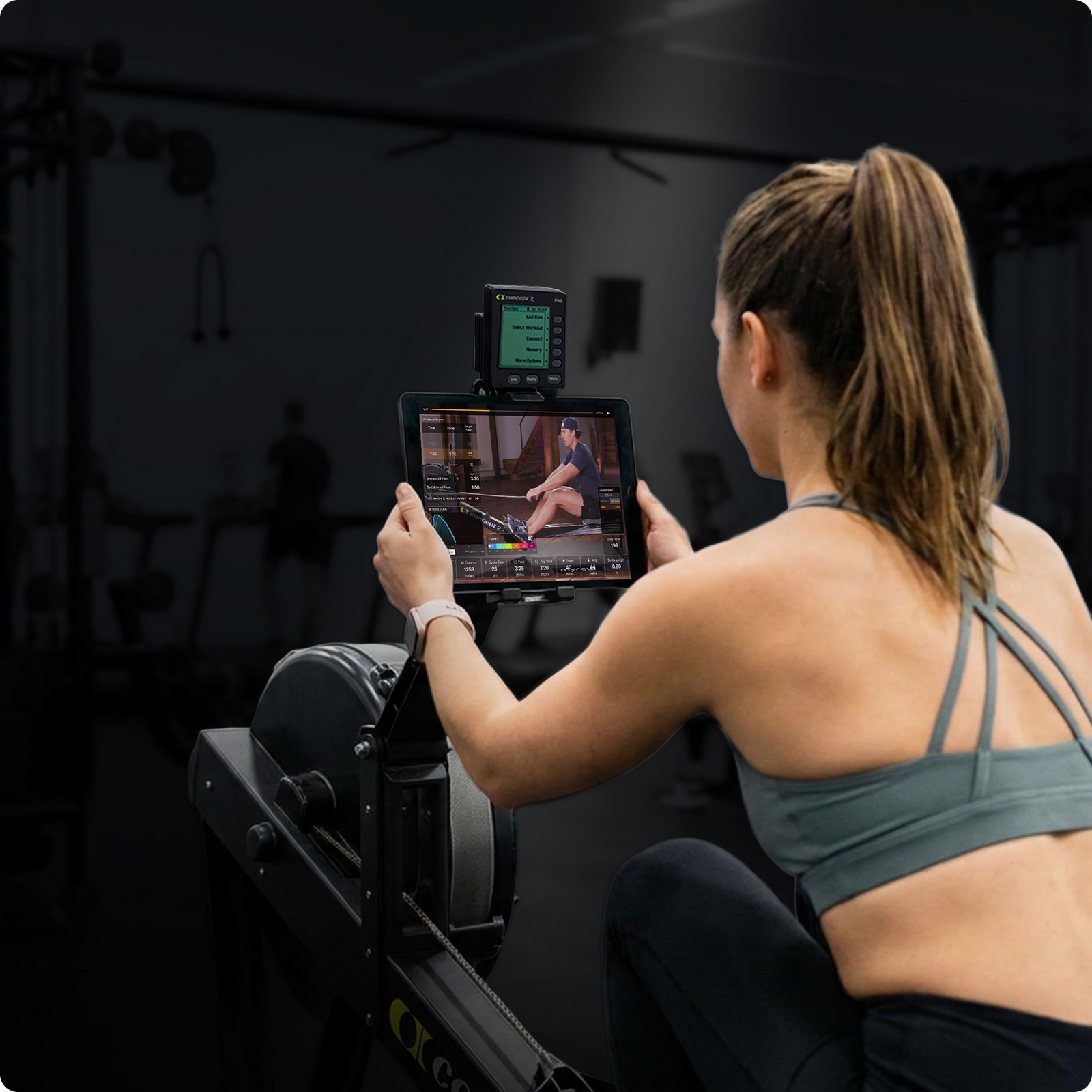 Woman rowing with myrow app on iPad